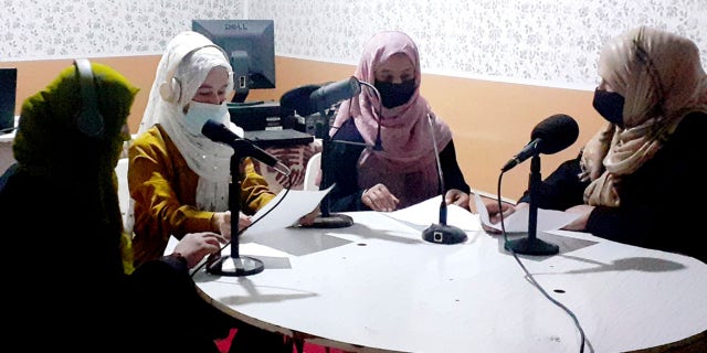 Najia Sorosh head of Sadai Banowan a women-run radio station, right, speaks with her Staff in the broadcasting studio in Badakhshan province, north-eastern of Afghanistan, Tuesday, Mar. 7, 2023.