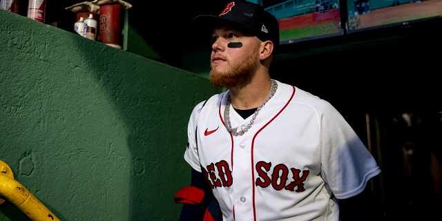 Alex Verdugo #99 of the Boston Red Sox walks into the dugout before a game against the Pittsburgh Pirates on April 4, 2023 at Fenway Park in Boston, Massachusetts.
