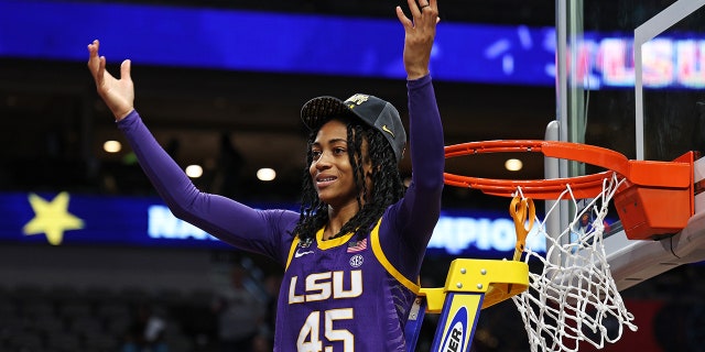 Alexis Morris of the LSU Lady Tigers poses during the net cutting ceremony after defeating the Iowa Hawkeyes, 102-85, during the NCAA Women's Basketball Tournament championship game at American Airlines Center on April 2, 2023, in Dallas, Texas.