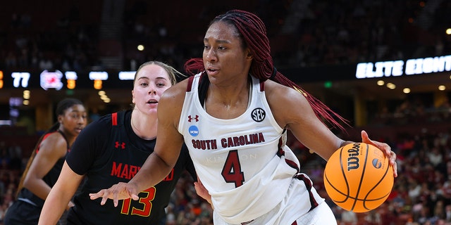 Aliyah Boston #4 of the South Carolina Gamecocks drives to the basket against the Maryland Terrapins during the fourth quarter of the Elite Eight round of the NCAA Women's Basketball Tournament at Bon Secours Wellness Arena on March 27, 2023 in Greenville, SC South.