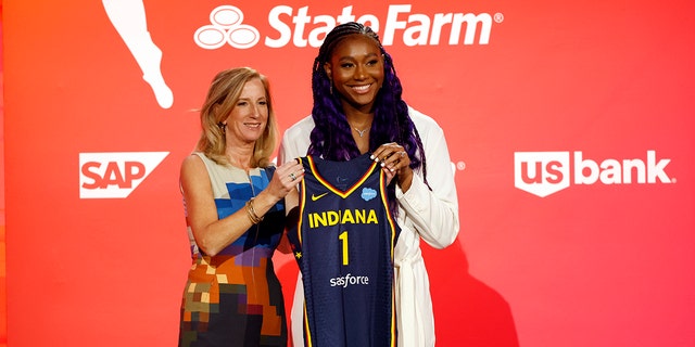 WNBA Commissioner Cathy Engelbert and Aliyah Boston pose for photos after Boston was drafted 1st overall by the Indiana Fever during the 2023 WNBA Draft at Spring Studios on April 10, 2023 in New York City.