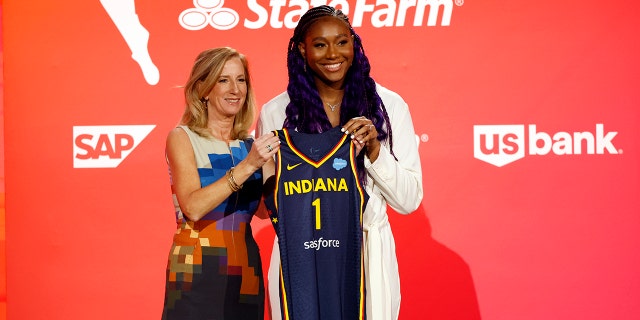 WNBA Commissioner Cathy Engelbert and Aliyah Boston pose for photos after Boston was selected first overall by the Indiana Fever during the 2023 WNBA Draft at Spring Studios on April 10, 2023 in the city of NY.