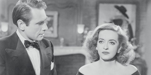 Davis' real-life husband Gary Merrill, who played Bill Sampson, and Bette Davis, as Margo Channing, are seen here in the classic film "All About Eve."
