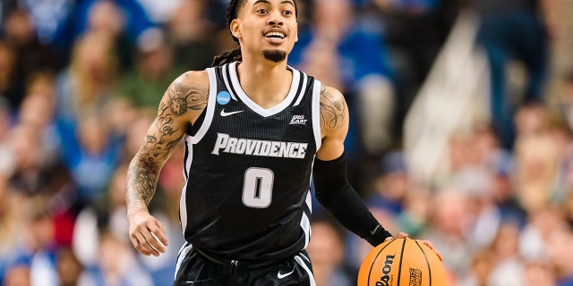 Alyn Breed of the Providence Friars brings the ball up court against the Kentucky Wildcats during an NCAA Men's Basketball Tournament game on March 17, 2023, in Greensboro, North Carolina.