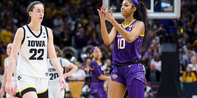 Lady Tigers forward Angel Reese gestures toward Iowa Hawkeyes guard Caitlin Clark after the Women's Final Four NCAA tournament on April 2, 2023, in Dallas.