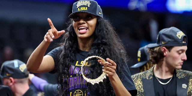 Angel Reese, forward for the LSU Lady Tigers, celebrates after defeating the Iowa Hawkeyes in the final round of the NCAA tournament at the American Airlines Center in Dallas on April 2, 2023.