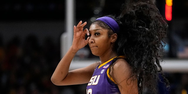 LSU's Angel Reese celebrates a three pointer during the first half of the NCAA Women's Final Four championship basketball game against Iowa Sunday, April 2, 2023, in Dallas.