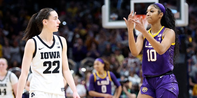 Apr 2, 2023; Dallas, TX, USA; LSU Lady Tigers forward Angel Reese (10) gestures to Iowa Hawkeyes guard Caitlin Clark (22) after the game during the final round of the Women's Final Four NCAA tournament at the American Airlines Center.