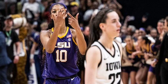 Angel Reese #10 of the LSU Lady Tigers reacts in front of Caitlin Clark #22 of the Iowa Hawkeyes towards the end of the 2023 NCAA Women's Basketball Tournament championship game at American Airlines Center on April 02, 2023 in Dallas, Texas.