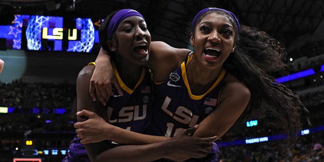 Angel Reese, No. 10, and Flau'jae Johnson, No. 4 of the LSU Lady Tigers, react after a 79-72 victory over the Virginia Tech Hokies during Game Four of the 2023 NCAA Women's Tournament at the American Airlines Center on March 31, 2023, in Dallas, Texas. 