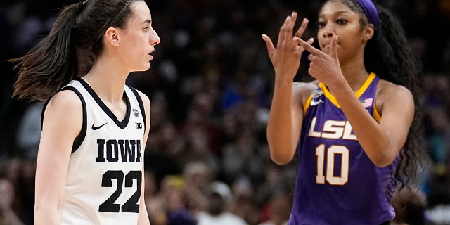 LSU's Angel Reese reacts in front of Iowa's Caitlin Clark during the second half of the NCAA Women's Final Four championship basketball game Sunday, April 2, 2023, in Dallas.