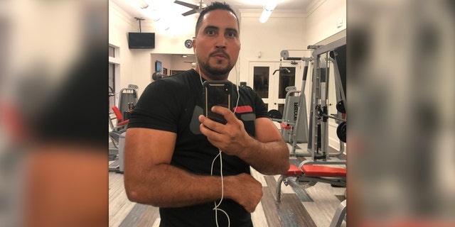Antonio Cordero Rios poses in the gym for a selfie