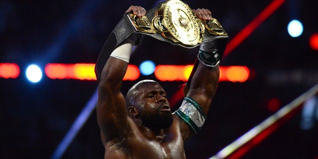 Apollo Crews lifts belt