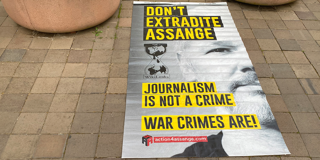 A sign opposing Julian Assange's extradition to the U.S. seen at a rally in Washington, D.C.