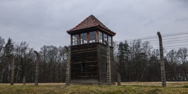 A watchtower and barb wired fence at the former Nazi German concentration and extermination camp Auschwitz Birkenau II during the 78th Anniversary of Auschwitz - Birkenau Liberation and International Holocaust Remembrance Day. Brzezinka, Poland, on January 27, 2023.