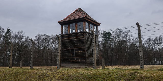 A watchtower and barb wired fence at the former Nazi German concentration and extermination camp Auschwitz Birkenau II during the 78th Anniversary of Auschwitz - Birkenau Liberation and International Holocaust Remembrance Day. Brzezinka, Poland, on January 27, 2023.