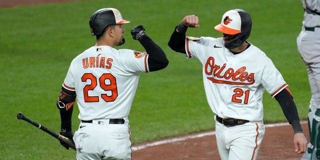 Austin Hays of the Orioles celebrates with Ramon Urias after hitting a home run against the Oakland Athletics at Camden Yards on April 10, 2023, in Baltimore.