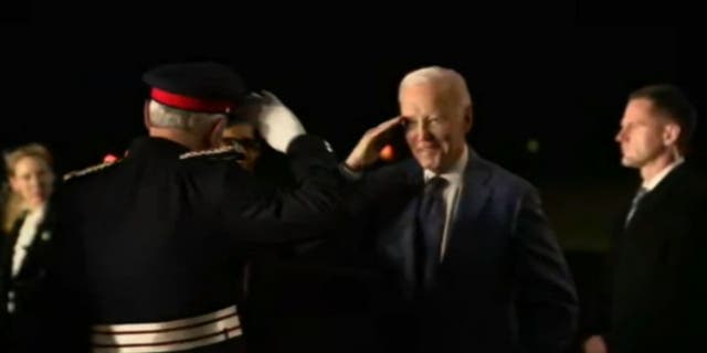 U.S. President Joe Biden salutes an Irish Military Officer