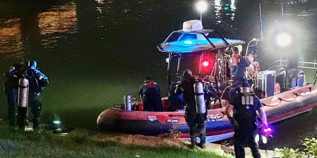 Police divers and a Fireboat