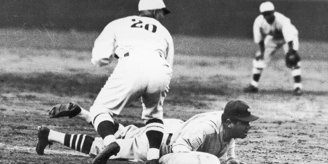 Babe Ruth is safe during a game between American and Japanese all-stars at Meiji Shire Grounds, Tokyo, Japan, Nov. 21, 1934.