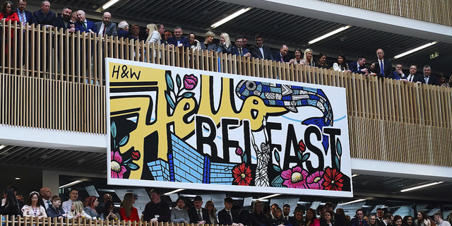 An audience gathers on balconies to listen to President Biden deliver his keynote speech at Ulster University in Belfast on Wednesday, April 12.