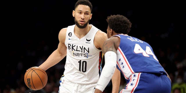 Nets guard Ben Simmons controls the ball against Philadelphia 76ers forward Paul Reed at Barclays Center in Brooklyn on Feb. 11, 2023.