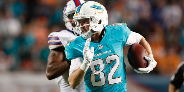 Wide receiver Brian Hartline, #82 of the Miami Dolphins, runs with the ball against the Buffalo Bills at Sun Life Stadium on Nov. 13, 2014 in Miami Gardens, Florida.