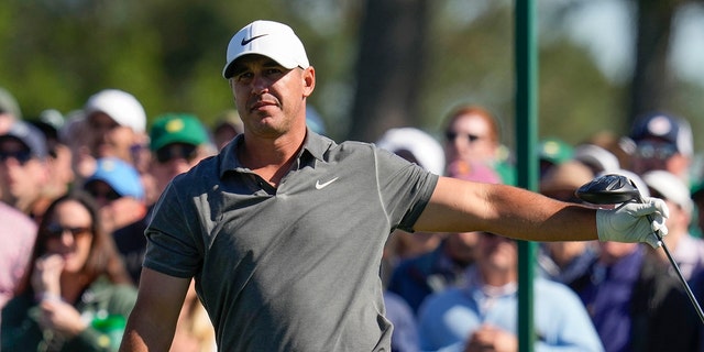Brooks Koepka watches his tee shot on the eighth hole during the final round of the Masters golf tournament at Augusta National Golf Club on Sunday, April 9, 2023, in Augusta, Ga.