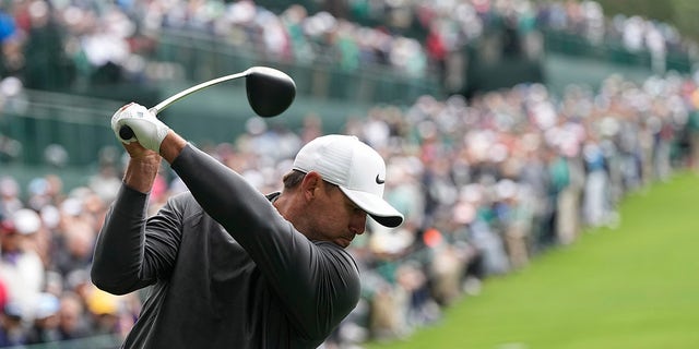 Brooks Koepka hits his tee shot on the 14th hole during the Masters at Augusta National Golf Club on Sunday, April 9, 2023.