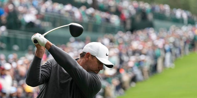 Brooks Koepka hits his tee shot on the 14th hole during the Masters at Augusta National Golf Club on Sunday, April 9, 2023.