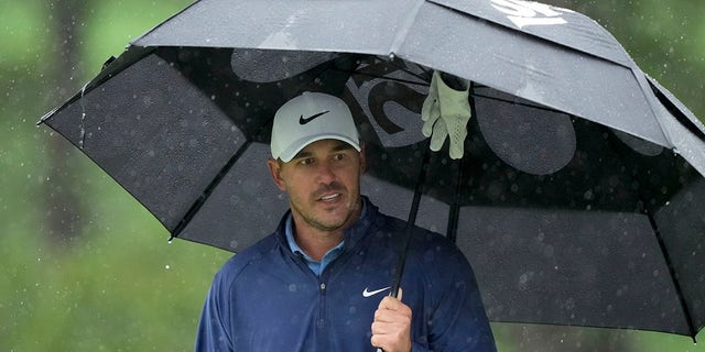 Brooks Koepka waits to tee off on the seventh hole during the weather-delayed third round of the Masters on Saturday, April 8, 2023.