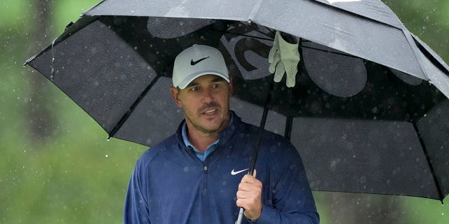 Brooks Koepka waits to tee off on the seventh hole during the weather-delayed third round of the Masters on Saturday, April 8, 2023.