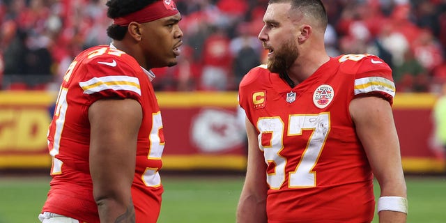 Kansas City Chiefs tight end Travis Kelce (87) and offensive tackle Orlando Brown Jr. (57) after a touchdown in the second quarter of an AFC divisional playoff game against the Jacksonville Jaguars on January 21 from 2023, at GEHA Field at Arrowhead Stadium.