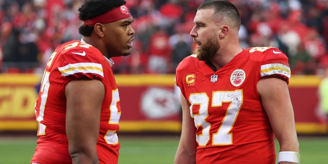 Kansas City Chiefs tight end Travis Kelce (87) and offensive tackle Orlando Brown Jr. (57) after a touchdown in the second quarter of an AFC divisional playoff game against the Jacksonville Jaguars on January 21 from 2023, at GEHA Field at Arrowhead Stadium.