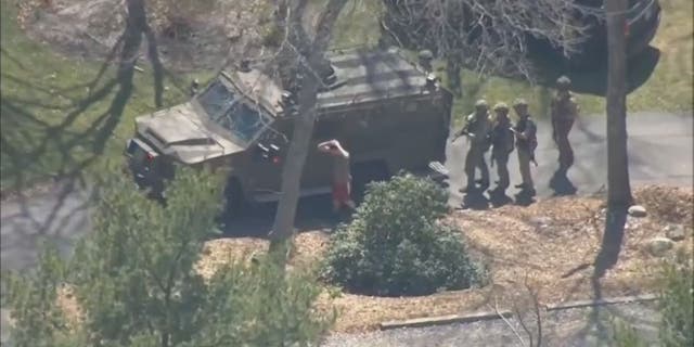 Aerial photo of the arrest of Air National Guardsman Jack Teixeira by FBI agents for allegedly leaking classified materials.