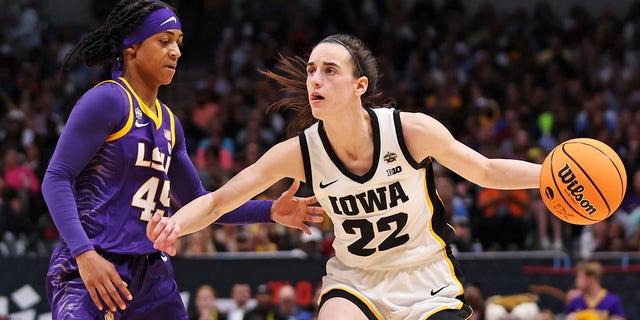 LSU Lady Tigers' Alexis Morris defends against Iowa Hawkeyes' Caitlin Clark during the NCAA Women's Basketball Tournament championship game at American Airlines Center on April 2, 2023 in Dallas.