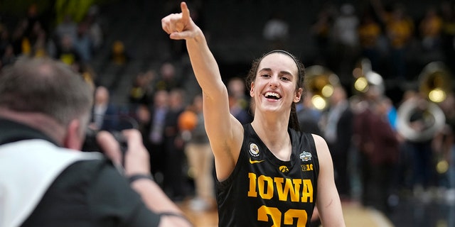 Iowa's Caitlin Clark celebrates after an NCAA Women's Final Four semifinals basketball game against South Carolina Friday, March 31, 2023, in Dallas.