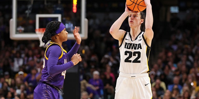 Caitlin Clark #22 of the Iowa Hawkeyes with the ball against Alexis Morris #45 of the LSU Lady Tigers during the third quarter during the 2023 NCAA Women's Basketball Tournament championship game at American Airlines Center on April 02, 2023 in Dallas, Texas.
