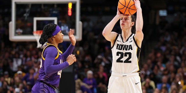 Caitlin Clark #22 of Iowa Hockey with the ball against Alexis Morris #45 of the LSU Lady Tigers during the third quarter during the 2023 NCAA Women's Basketball Championship game at the American Airlines Center on April 02, 2023 in Dallas, Texas.
