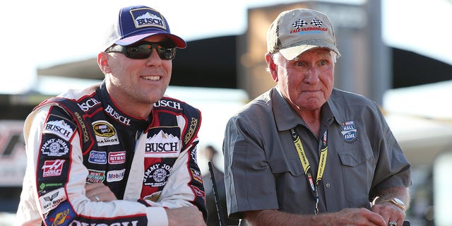 Kevin Harvick rides with Hall of Famer Cale Yarborough during pre-race festivities for the NASCAR Sprint Cup Series Bojangles' Southern 500 at Darlington Raceway on September 4, 2016, in South Carolina.