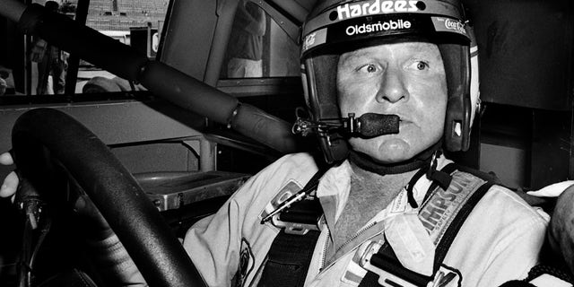 Cale Yarborough sits in his car prior to the start of the 1986 Pepsi Firecracker 400 stock car race at Daytona International Speedway in Florida.