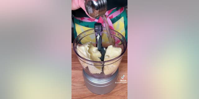 Carolina Gelen blends vodka butter in a food processor. The two ingredients create a smooth creamy food dip that can complement meals.