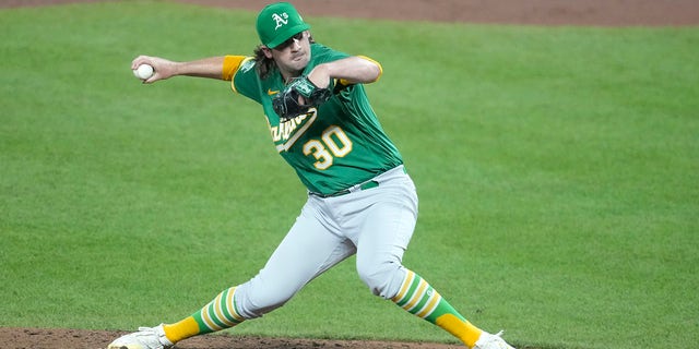 Chad Smith of the Oakland Athletics pitches in the ninth for his first career win against the Orioles at Camden Yards on April 12, 2023, in Baltimore.