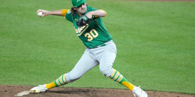 Chad Smith of the Oakland Athletics pitches in the ninth for his first career win against the Orioles at Camden Yards on April 12, 2023, in Baltimore.