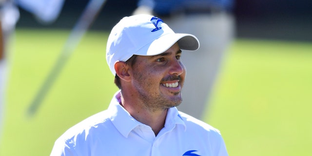 Chase Koepka smiles on course