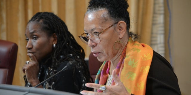 Cheryl Grills, right, and Lisa Holder, left, both members of the California Reparations Task Force