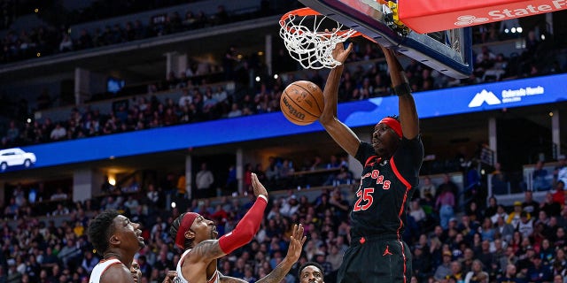 Chris Boucher #25 of the Toronto Raptors scores on a first half slam dunk against the Denver Nuggets at Ball Arena on March 6, 2023 in Denver, Colorado.