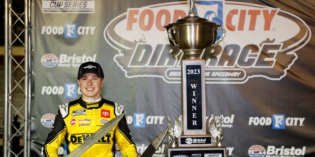 Christopher Bell, driver of the #20 DeWalt Power Stack Toyota, celebrates in victory lane after winning the NASCAR Cup Series Food City Dirt Race at Bristol Motor Speedway on April 09, 2023 in Bristol, Tennessee.