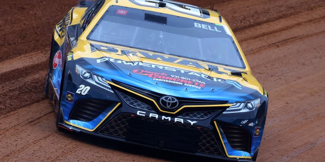 Christopher Bell, driver of the #20 DeWalt Power Stack Toyota, drives during qualifying heat #1 for the NASCAR Cup Series Food City Dirt Race on Dirt at Bristol Motor Speedway on April 08, 2023 in Bristol, Tennessee.