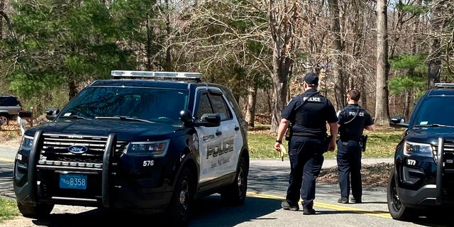 Police block a road in North Dighton, Massachusetts, on April 13, 2023. The FBI wanted to question a 21-year-old member of the Massachusetts Air National Guard in connection with the disclosure of highly classified military documents on the Ukraine war.